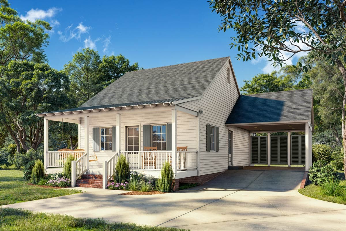 A charming, white-sided cottage with a front porch swing and a carport. Lush greenery surrounds the house under a bright, sunny sky.