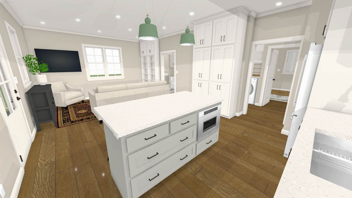 A modern, open-concept kitchen and living area with a large island, cabinets, and hardwood floors. A washer and dryer are visible.