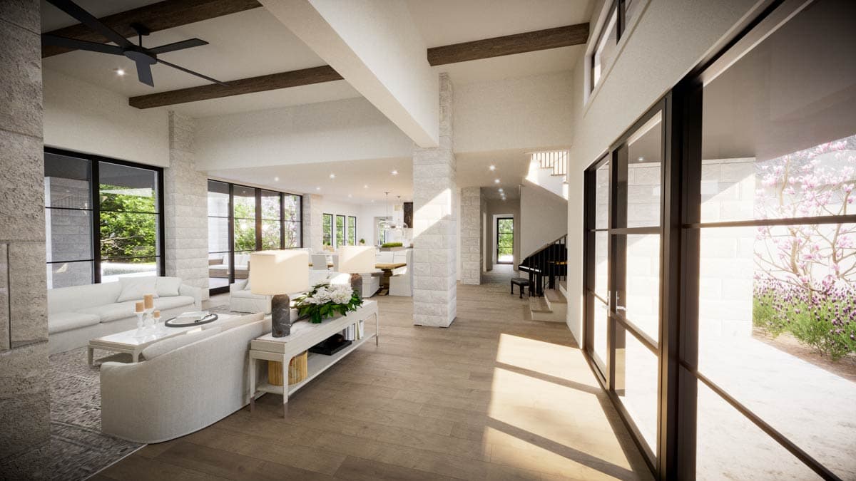 Spacious, modern living room with large windows, white walls, wood floors, and a piano. Light streams in. 