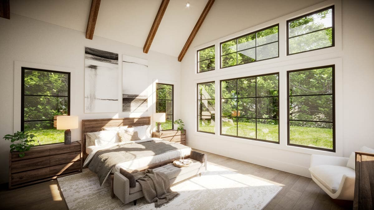 Bright bedroom with large windows overlooking a lush green yard, wooden beams and a modern bed with stylish decor.
