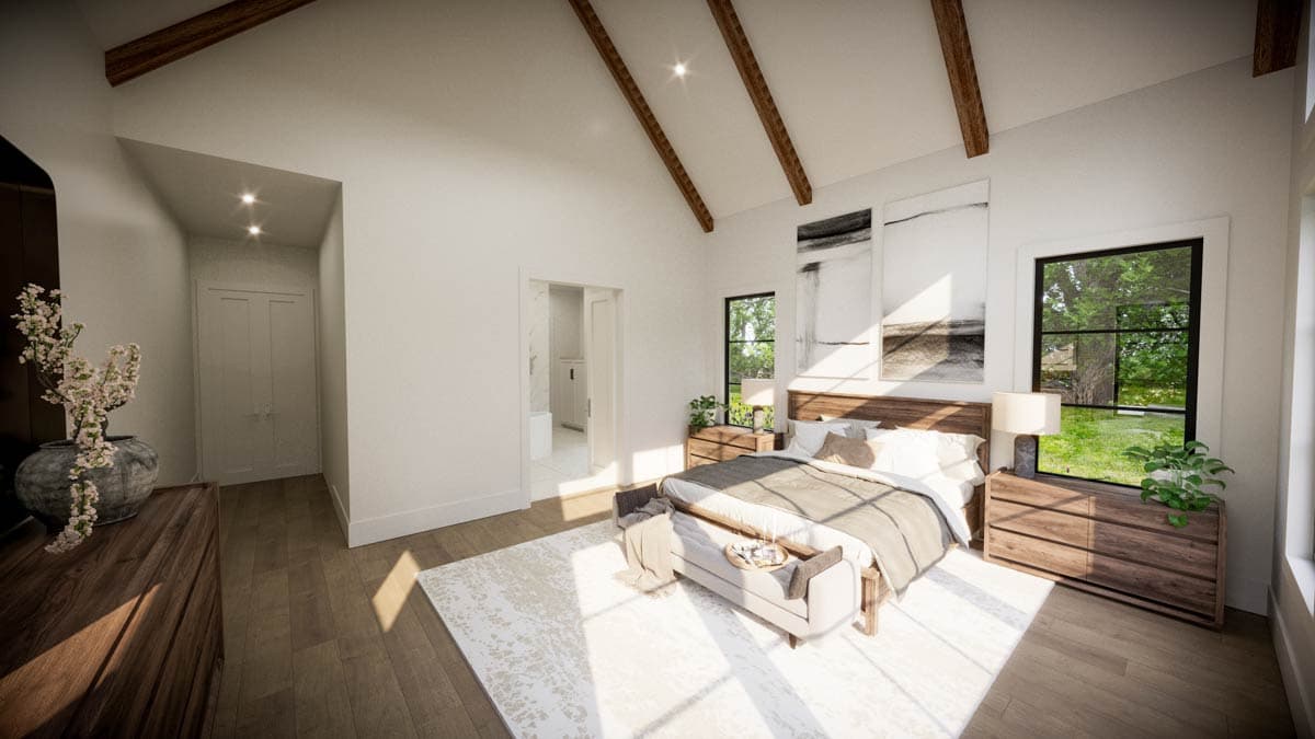 Spacious, modern bedroom with wood accents, vaulted ceiling, and large windows overlooking a lush green yard.